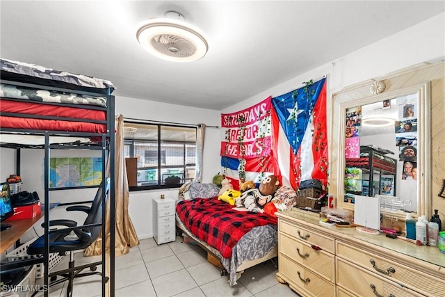 bedroom with light tile patterned floors