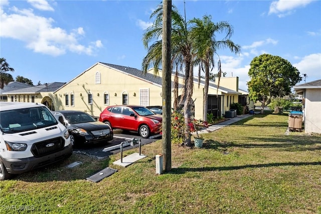 uncovered parking lot featuring a residential view