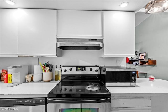 kitchen featuring light countertops, appliances with stainless steel finishes, white cabinetry, and under cabinet range hood