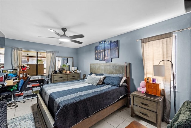 bedroom with light tile patterned floors and a ceiling fan