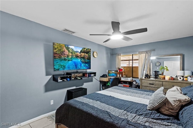 bedroom with light tile patterned floors, baseboards, visible vents, and a ceiling fan