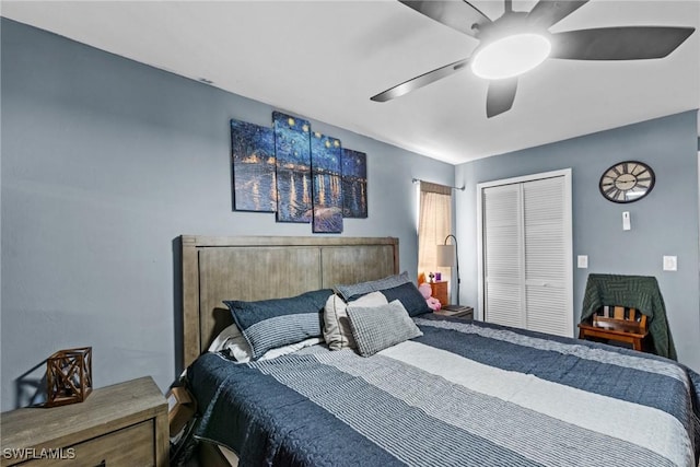 bedroom with ceiling fan and a closet