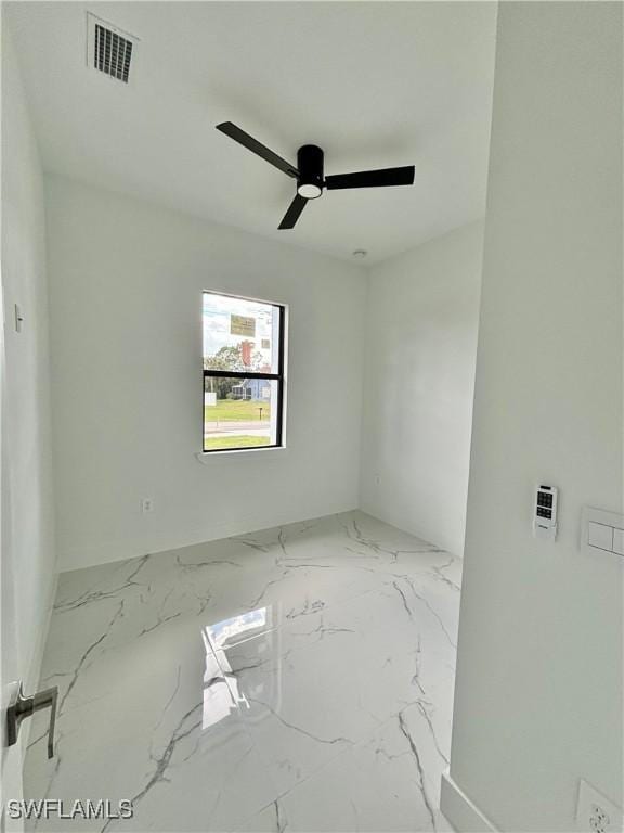 unfurnished room with ceiling fan