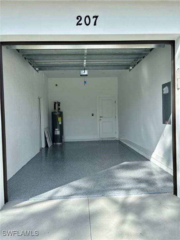 garage featuring water heater and a garage door opener