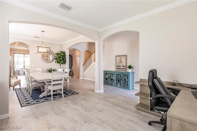 dining area with a notable chandelier and crown molding