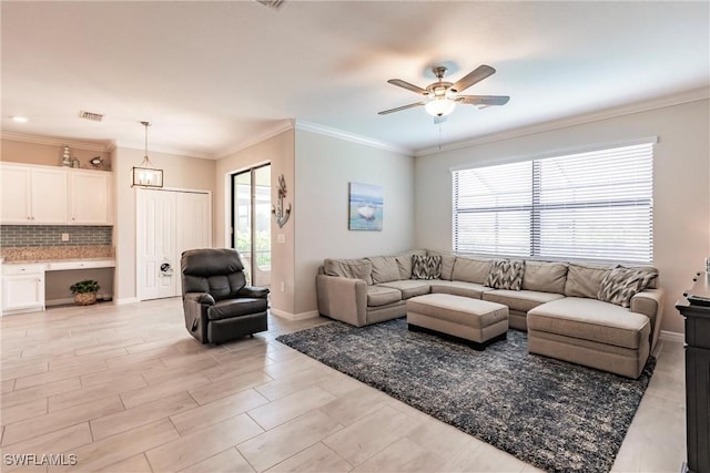 living room featuring crown molding and ceiling fan