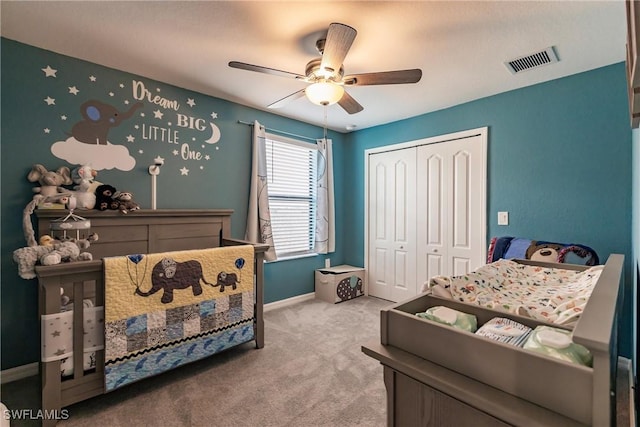 bedroom with carpet floors, a closet, and ceiling fan