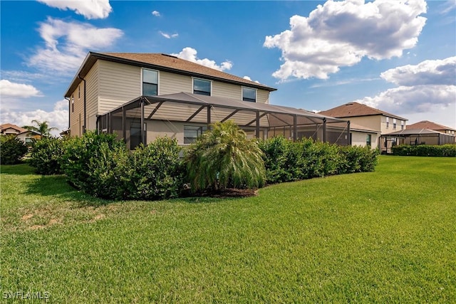 exterior space with a yard and a lanai