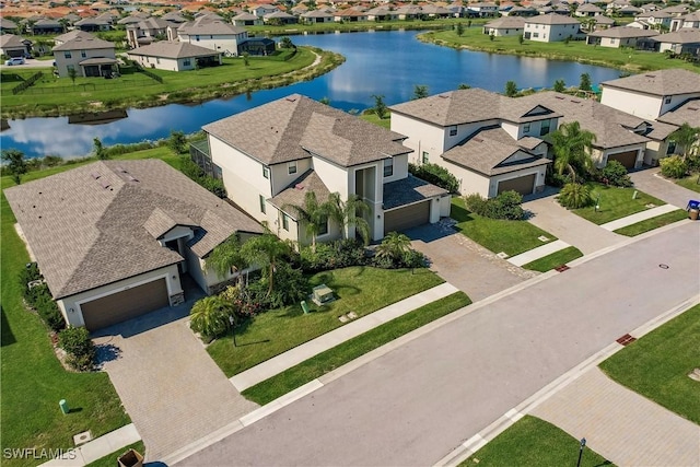 birds eye view of property with a water view