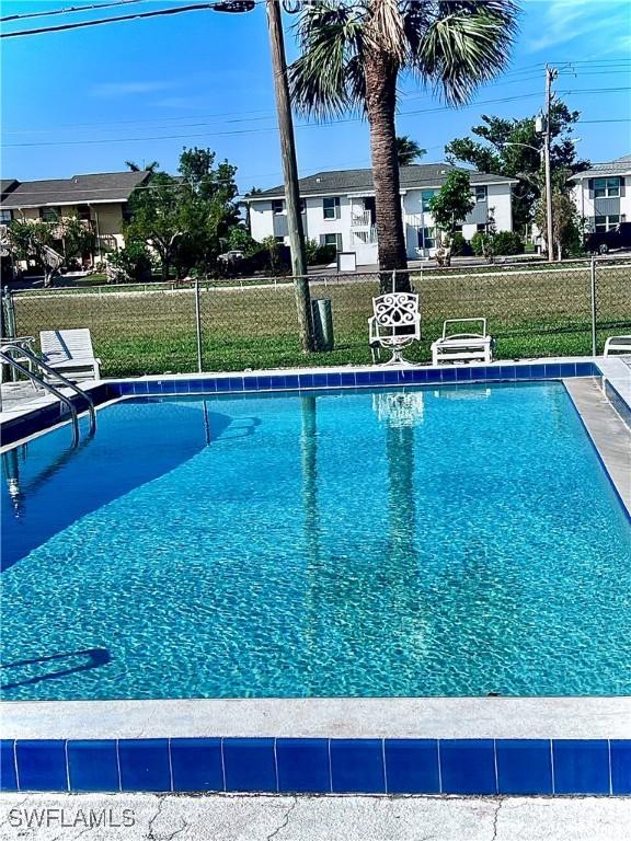 community pool featuring fence