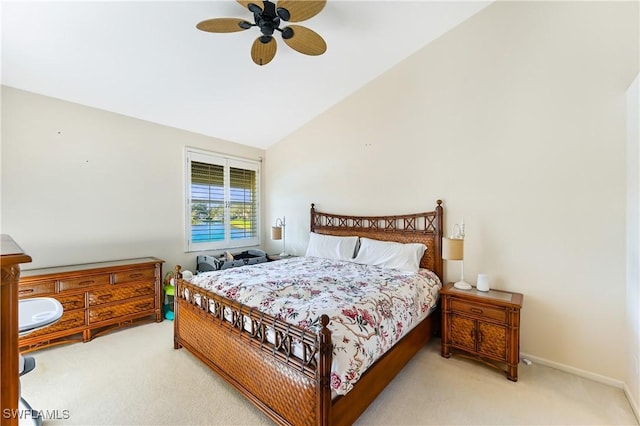 carpeted bedroom with vaulted ceiling and ceiling fan