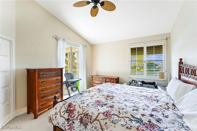 carpeted bedroom featuring ceiling fan, lofted ceiling, access to exterior, and multiple windows