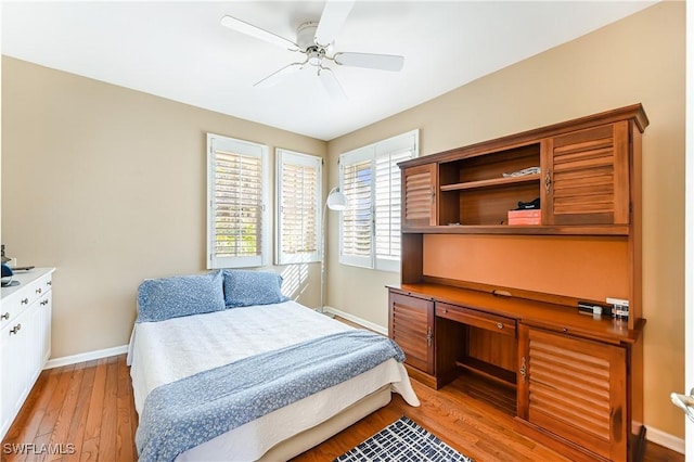 bedroom featuring ceiling fan and light hardwood / wood-style floors