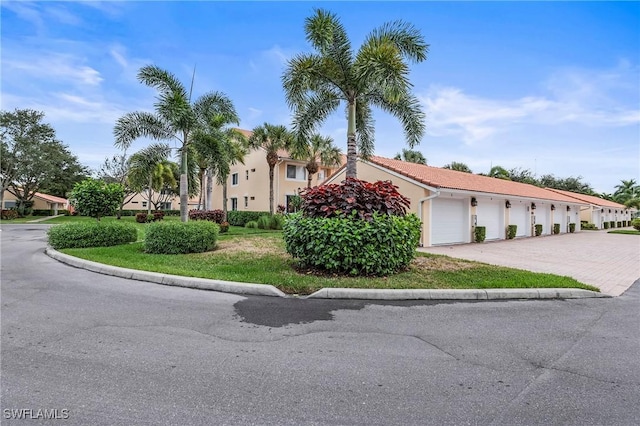 mediterranean / spanish home with a garage