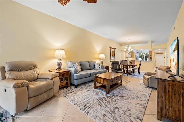 living room featuring an inviting chandelier and light tile patterned floors