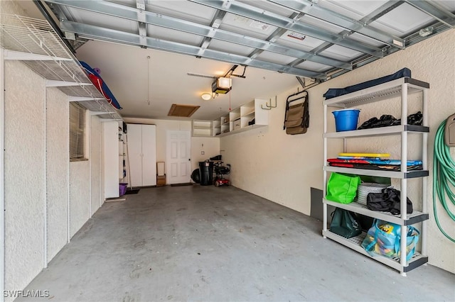 garage featuring a garage door opener