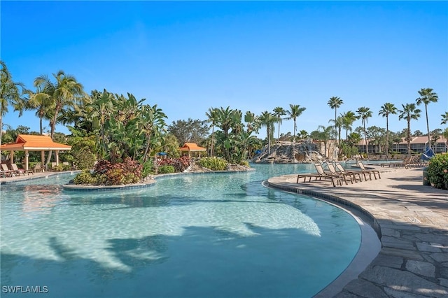 view of swimming pool featuring a patio area