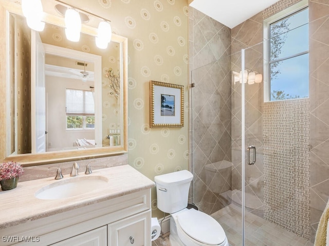 28732 La Caille Dr, Naples, FL 34119 - bathroom featuring toilet, a stall shower, vanity, and wallpapered walls