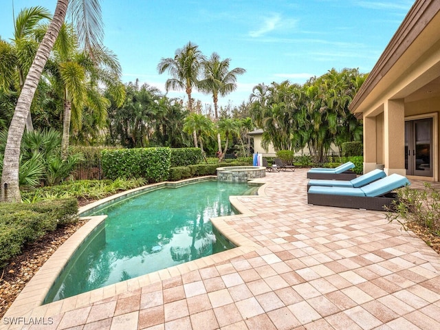 28732 La Caille Dr, Naples, FL 34119 - view of swimming pool featuring a patio, fence, and a pool with connected hot tub