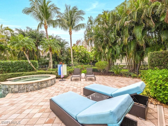 28732 La Caille Dr, Naples, FL 34119 - view of patio / terrace with an in ground hot tub and fence