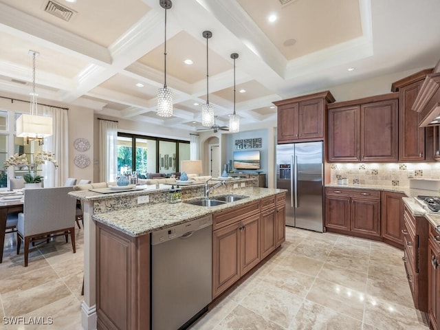 28732 La Caille Dr, Naples, FL 34119 - kitchen featuring backsplash, hanging light fixtures, a sink, visible vents, and appliances with stainless steel finishes