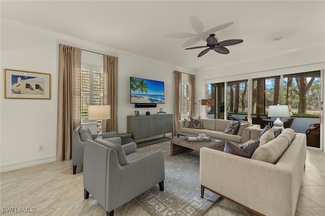 living area featuring a ceiling fan, crown molding, and baseboards