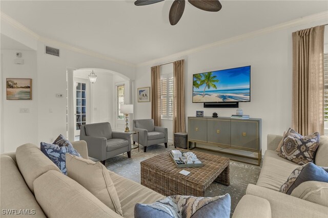 2850 Tiburon Blvd E Unit 101, Naples, FL 34109 - living room with ornamental molding, a ceiling fan, arched walkways, and visible vents