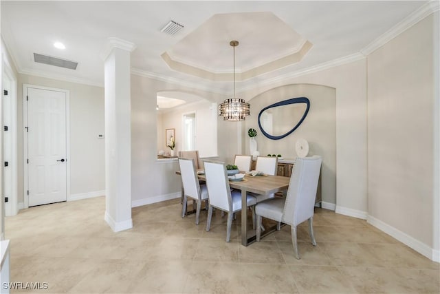 dining area with ornamental molding, visible vents, and baseboards