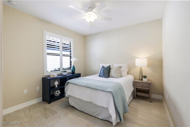 bedroom featuring baseboards and a ceiling fan