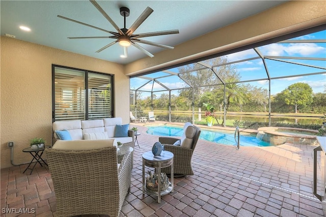 view of patio featuring ceiling fan, glass enclosure, an outdoor living space, visible vents, and a pool with connected hot tub