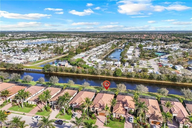 bird's eye view with a water view and a residential view