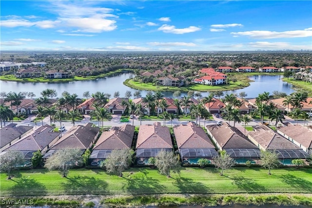 birds eye view of property featuring a water view and a residential view