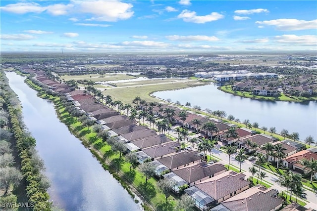 bird's eye view featuring a water view and a residential view