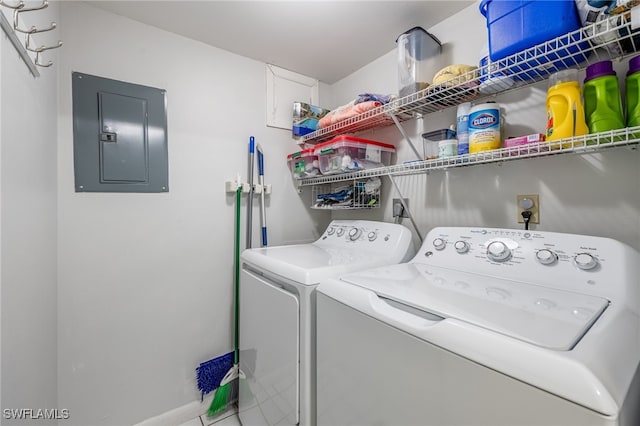 laundry area with washer and clothes dryer and electric panel