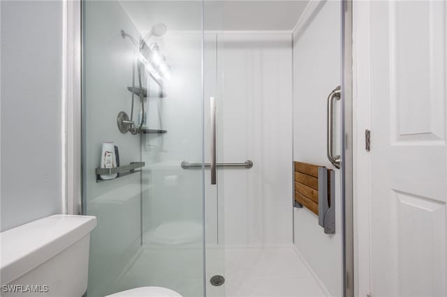 bathroom with toilet and walk in shower