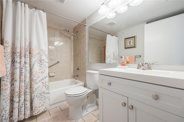 full bathroom with shower / tub combo, vanity, toilet, and tile patterned flooring