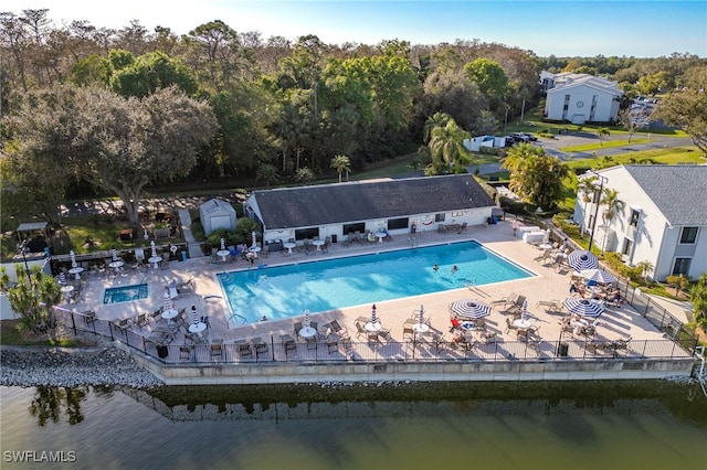 view of swimming pool with a patio