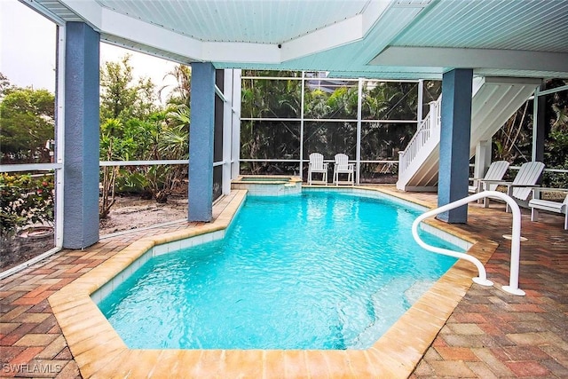 view of swimming pool with an in ground hot tub and a patio