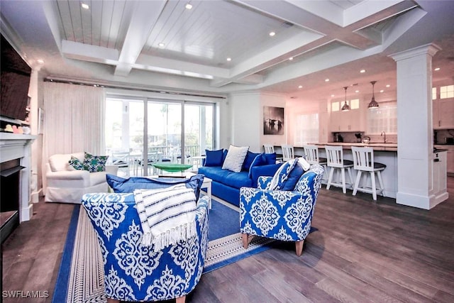 living room featuring ornate columns, coffered ceiling, dark hardwood / wood-style flooring, and beam ceiling