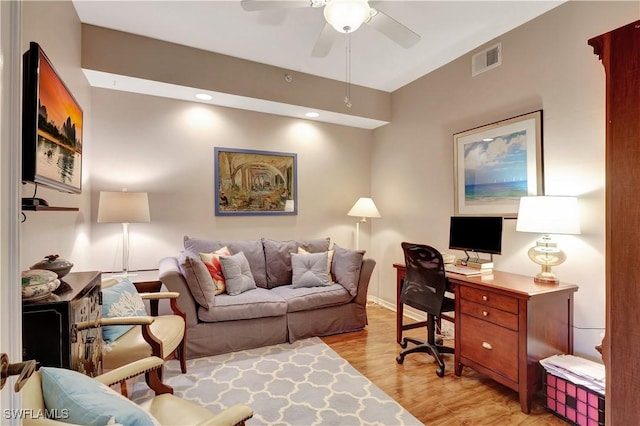 office featuring ceiling fan, visible vents, and light wood-style floors