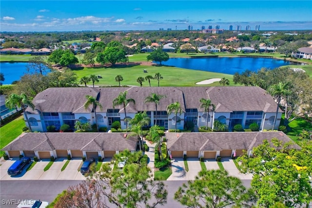 birds eye view of property featuring a water view and a residential view