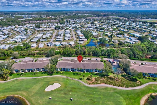 drone / aerial view featuring a residential view and golf course view