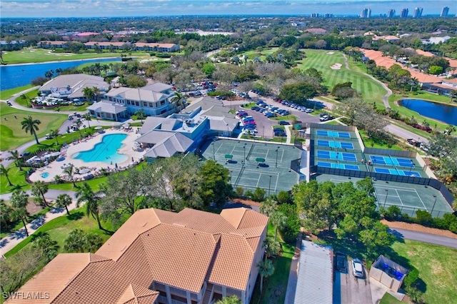 aerial view featuring golf course view and a water view