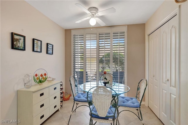 dining area featuring light tile patterned flooring and ceiling fan