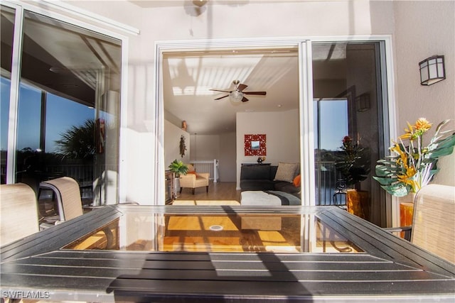 interior space with ceiling fan