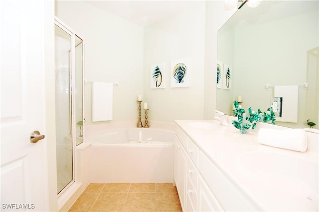 bathroom featuring vanity, separate shower and tub, and tile patterned floors