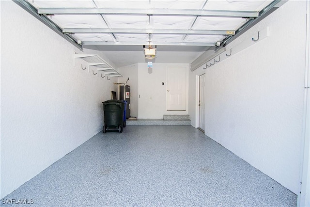 garage featuring a garage door opener and water heater