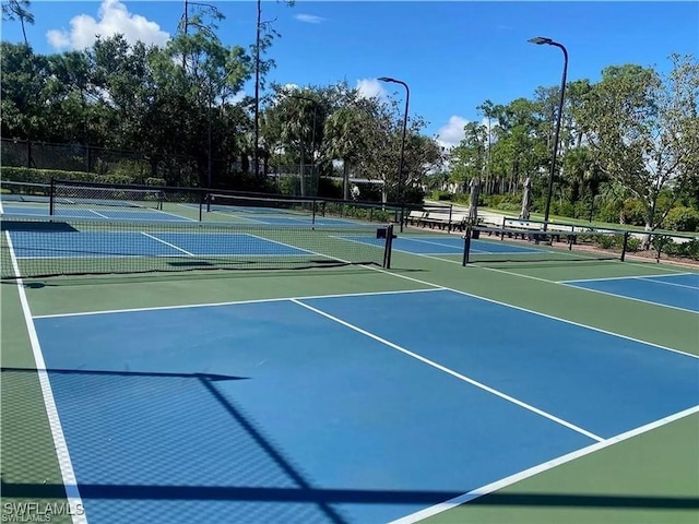 view of sport court with basketball hoop