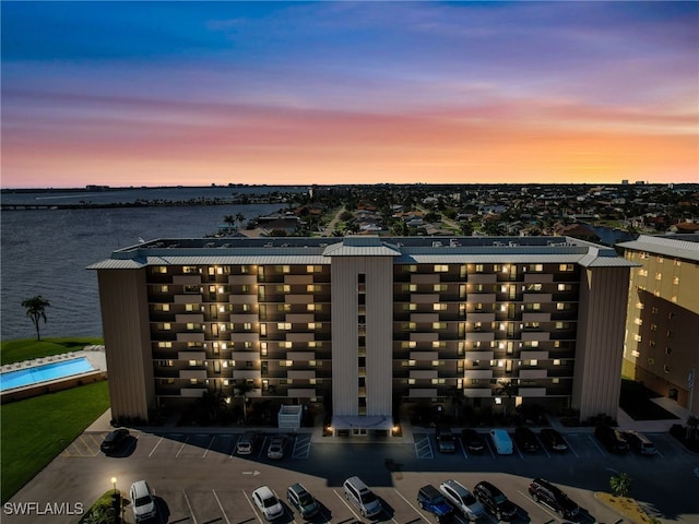 aerial view at dusk with a water view