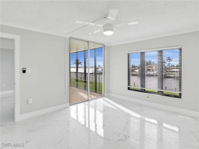 empty room with a textured ceiling, crown molding, and plenty of natural light